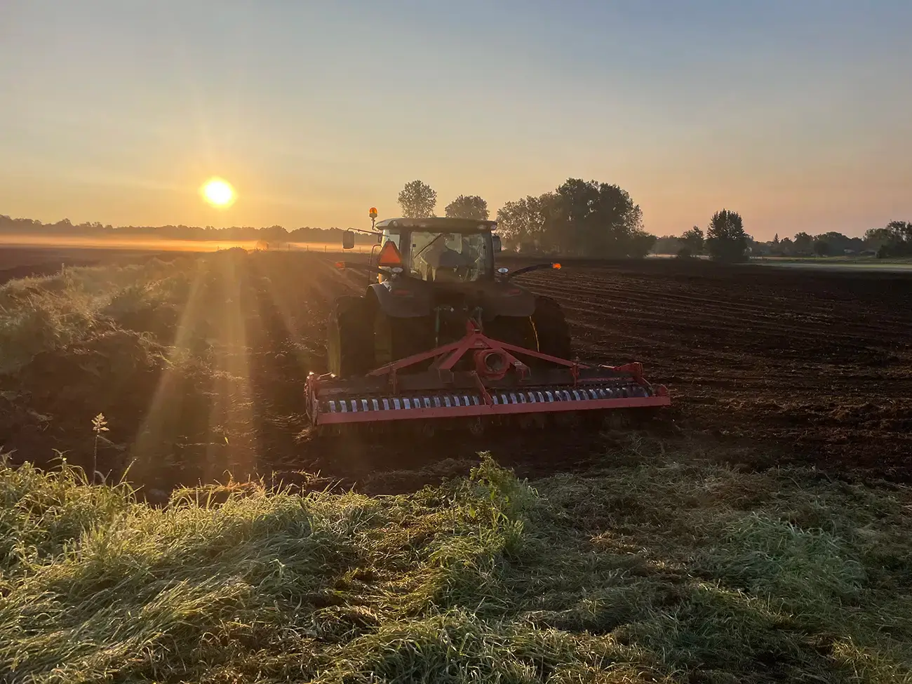 How we grow sod Michigan Sod Grower Working the field